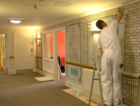 Cafe wallpaper mural designed for dementia care being installed in a Care Home